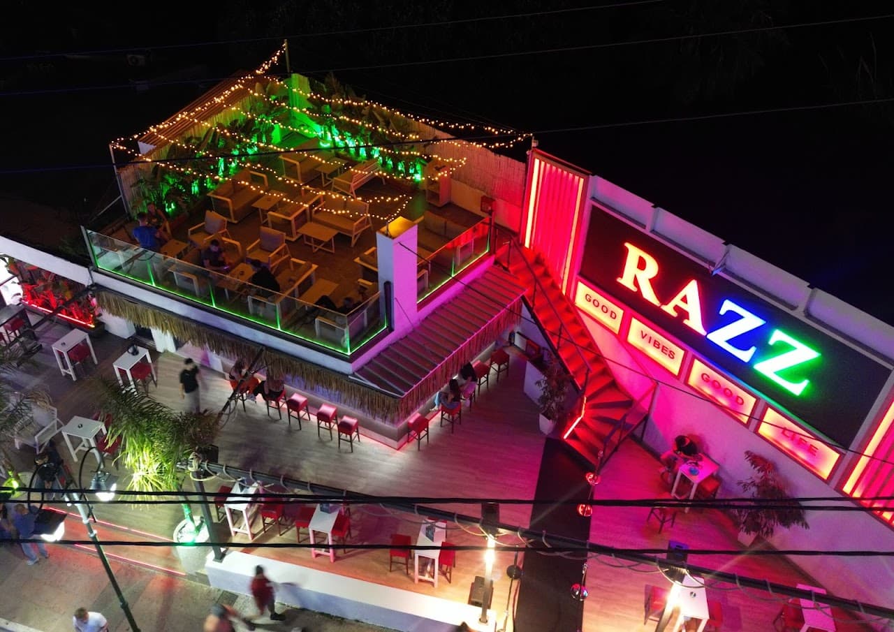 The Razz rooftop terrace lit up at night in Malia