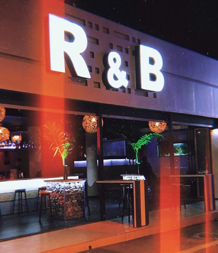 R&B Plus facade at night